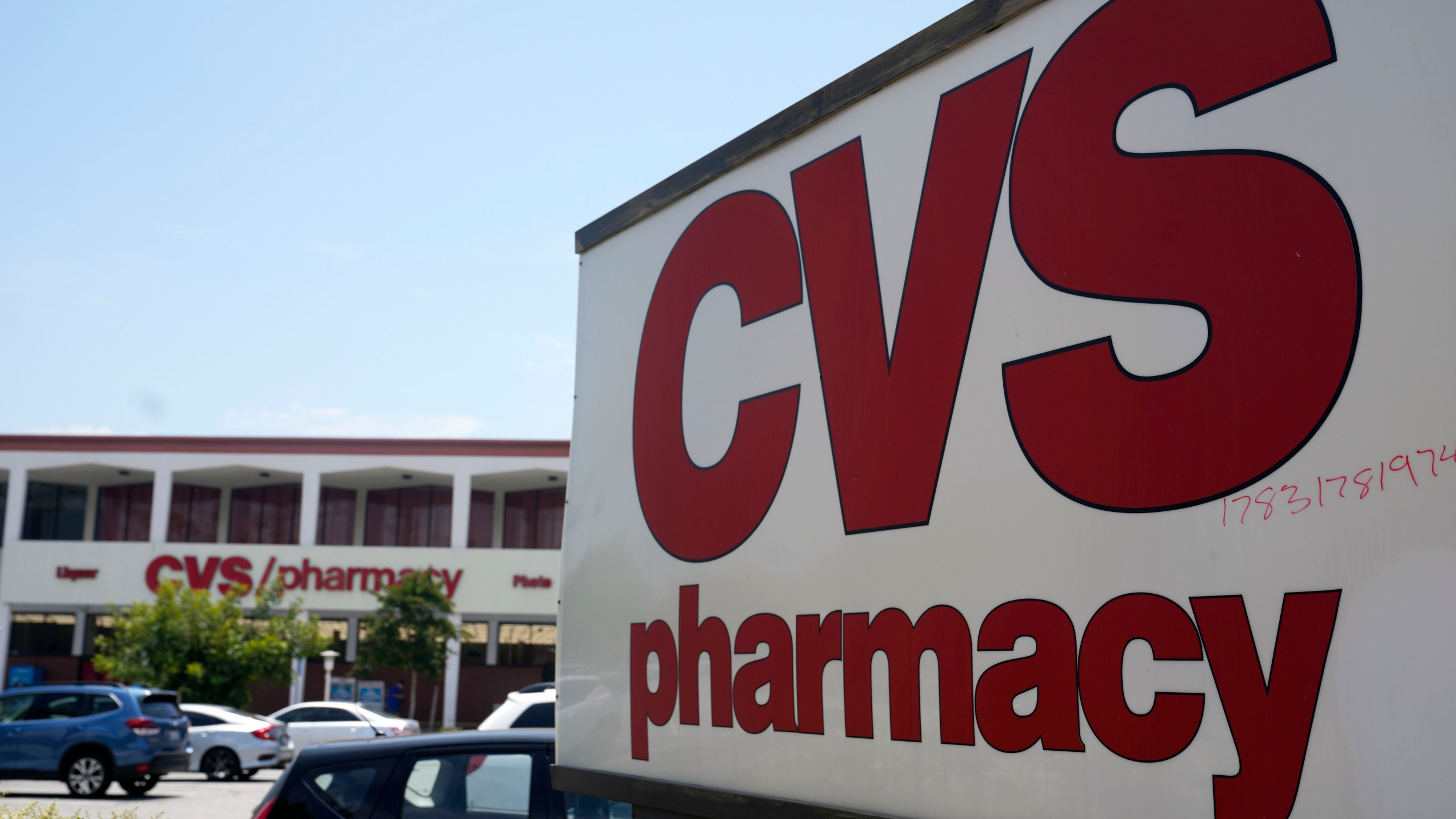 FILE - A sign marks a CVS branch on May 16, 2023, in Pasadena, Calif. (AP Photo/Marcio Jose Sanchez, File)