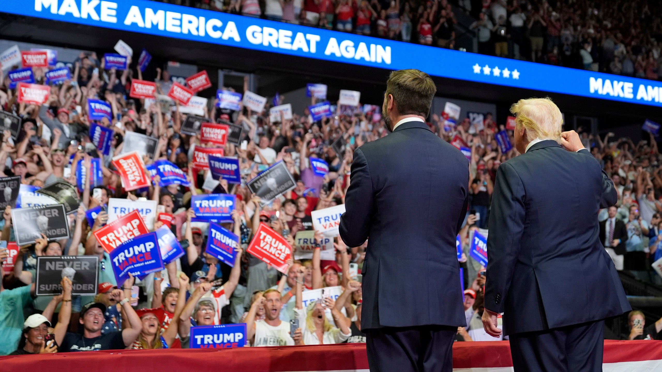 FILE - Republican presidential nominee former President Donald Trump and Republican vice presidential nominee Sen. JD Vance, R-Ohio, arrive a campaign rally, July 20, 2024, in Grand Rapids, Mich. (AP Photo/Evan Vucci)