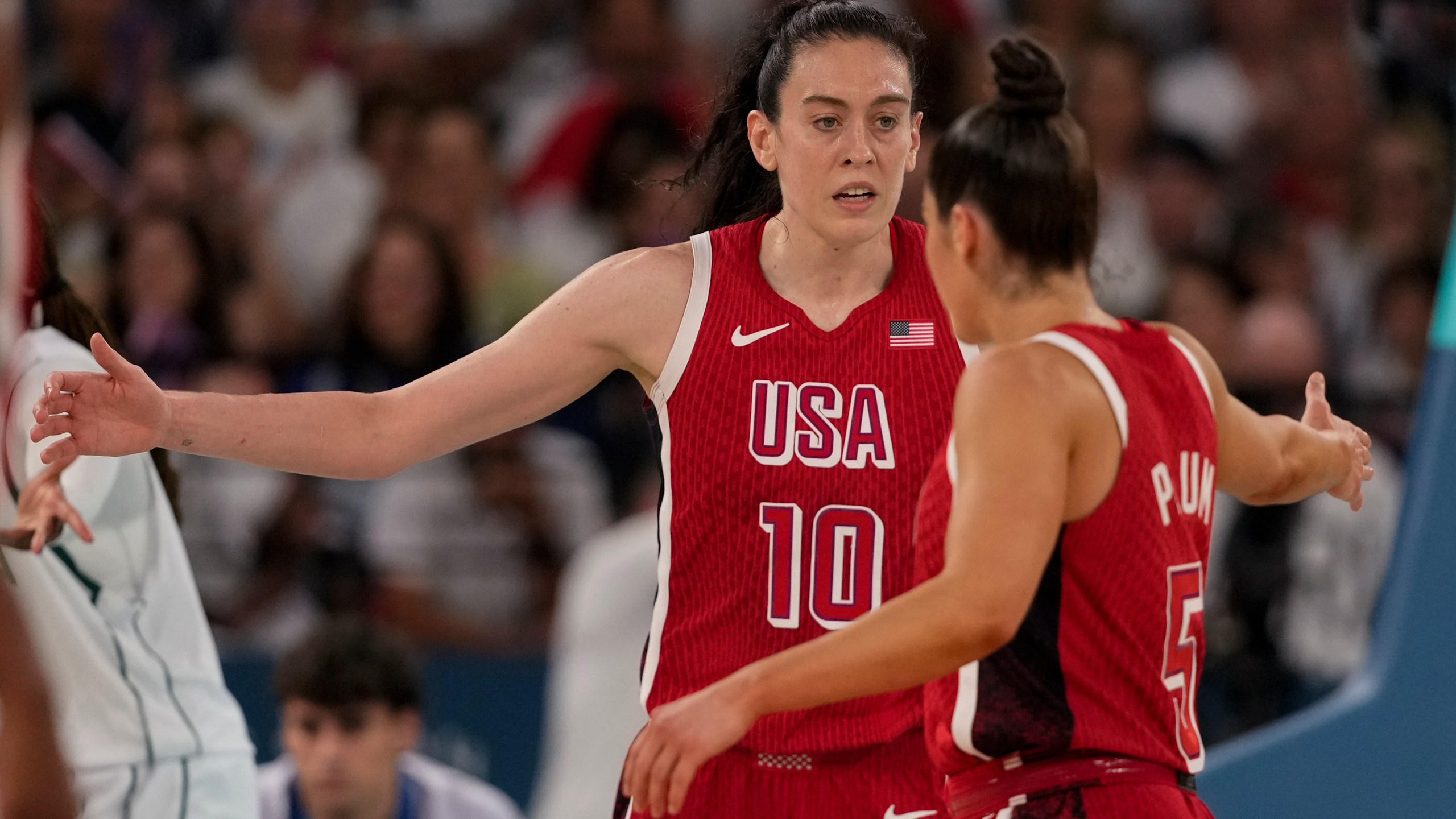 United States' Breanna Stewart (10) celebrates with Kelsey Plum (5) after a basket against Nigeria during a women's quarterfinal game at Bercy Arena at the 2024 Summer Olympics, Wednesday, Aug. 7, 2024, in Paris, France. (AP Photo/Mark J. Terrill)