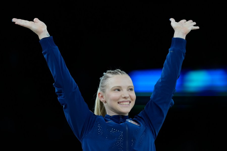 Jade Carey, of the United States, celebrates after winning the bronze medal during the medal ceremony after the women's artistic gymnastics individual vault finals at Bercy Arena at the 2024 Summer Olympics, Saturday, Aug. 3, 2024, in Paris, France. (AP Photo/Francisco Seco)