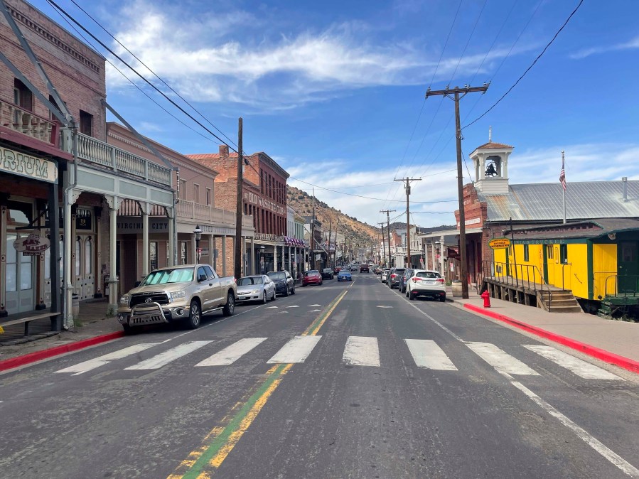 FILE - Cars line the main stretch of Virginia City, Nev., that attracts tens of thousands of tourists. (AP Photo/Gabe Stern, File)