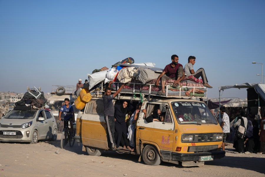 Palestinians flee the Khan Younis area of the Gaza Strip, following Israeli military evacuation orders, saying its forces will soon operate there, Thursday, Aug. 8, 2024. (AP Photo/Abdel Kareem Hana)