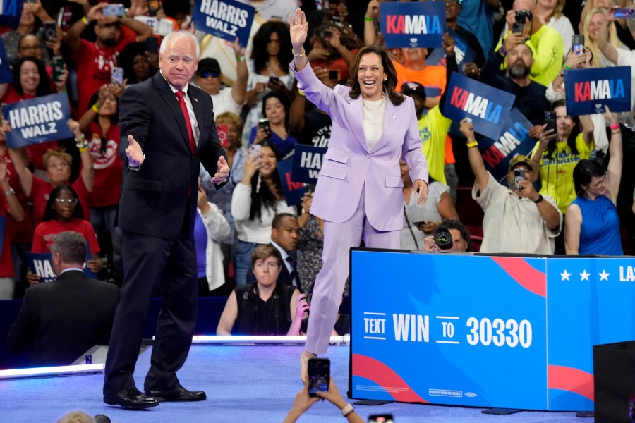 Democratic presidential nominee Vice President Kamala Harris, right, and running mate Minnesota Gov. Tim Walz are pictured at a campaign rally at the University of Nevada, Las Vegas on Saturday, Aug. 10, 2024. (AP Photo/Jae Hong)