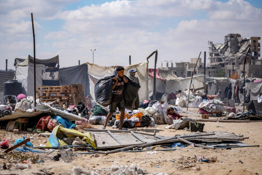 Palestinians displaced by the Israeli air and ground offensive on the Gaza Strip flee from Hamad City, following an evacuation order by the Israeli army to leave parts of the southern area of Khan Younis, Sunday, Aug. 11, 2024. (AP Photo/Abdel Kareem Hana)