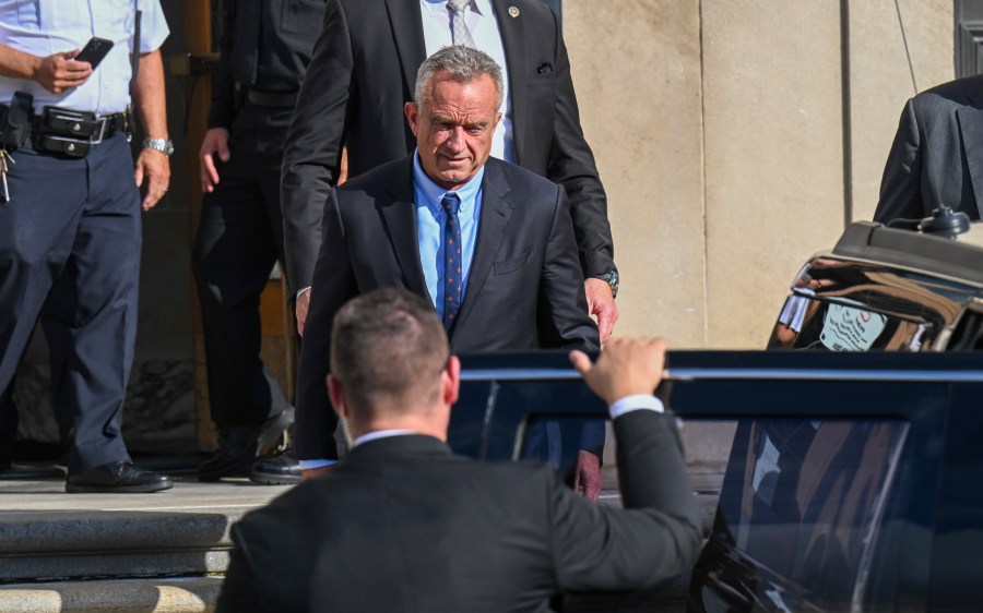 FILE - Independent presidential candidate Robert F. Kennedy Jr., top, leaves after giving testimony at the Albany County Courthouse, Aug. 7, 2024, in Albany, N.Y. (AP Photo/Hans Pennink, File)