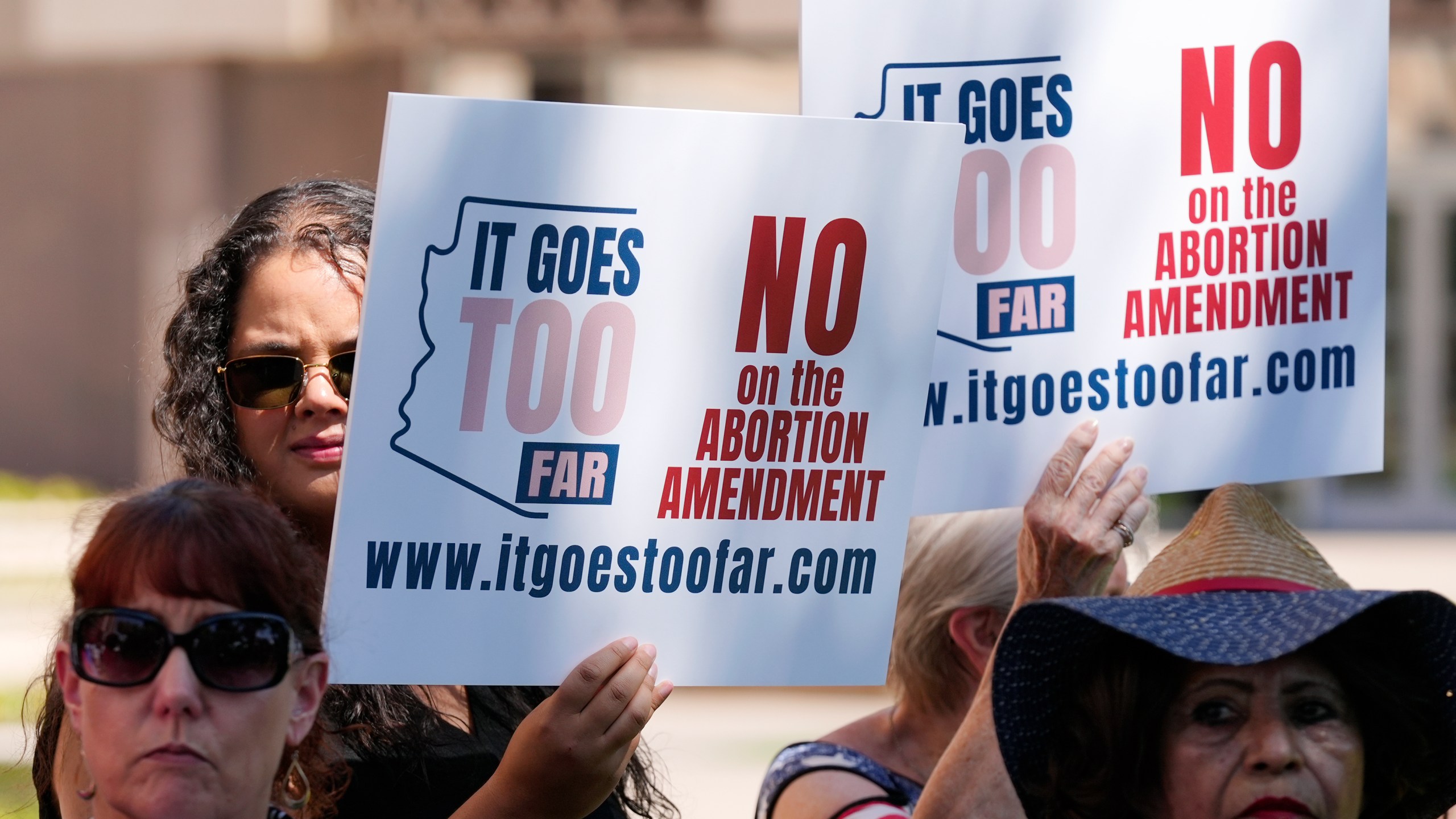 FILE - Anti-abortion protesters gather for a news conference after Arizona abortion-rights supporters delivered more than 800,000 petition signatures to the state Capitol to get abortion rights on the November general election ballot, July 3, 2024, in Phoenix. (AP Photo/Ross D. Franklin, File)