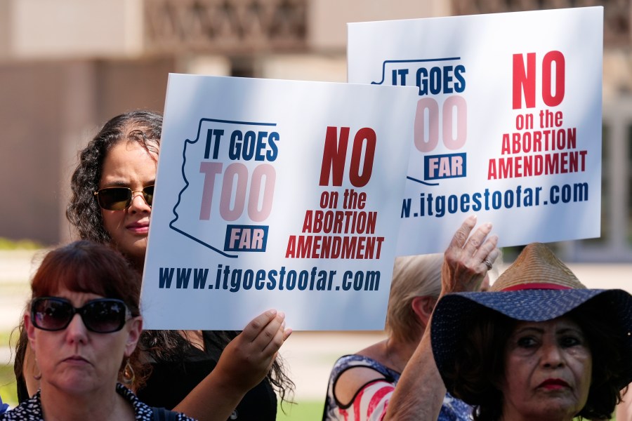 FILE - Anti-abortion protesters gather for a news conference after Arizona abortion-rights supporters delivered more than 800,000 petition signatures to the state Capitol to get abortion rights on the November general election ballot, July 3, 2024, in Phoenix. (AP Photo/Ross D. Franklin, File)