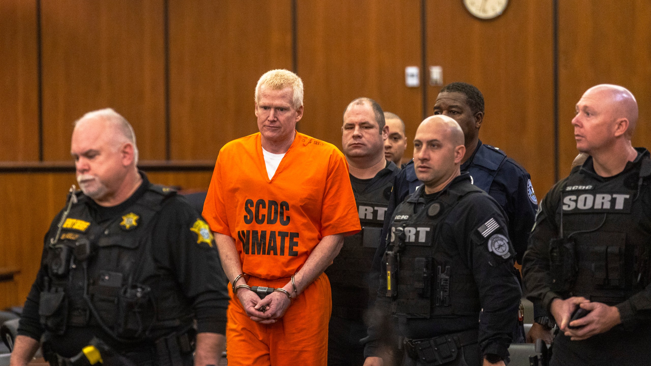 FILE - Alex Murdaugh, second from left, is brought out into the courtroom during a jury-tampering hearing at the Richland County Judicial Center, Monday, Jan. 29, 2024, in Columbia, S.C. (Andrew J. Whitaker/The Post And Courier via AP, Pool, File)