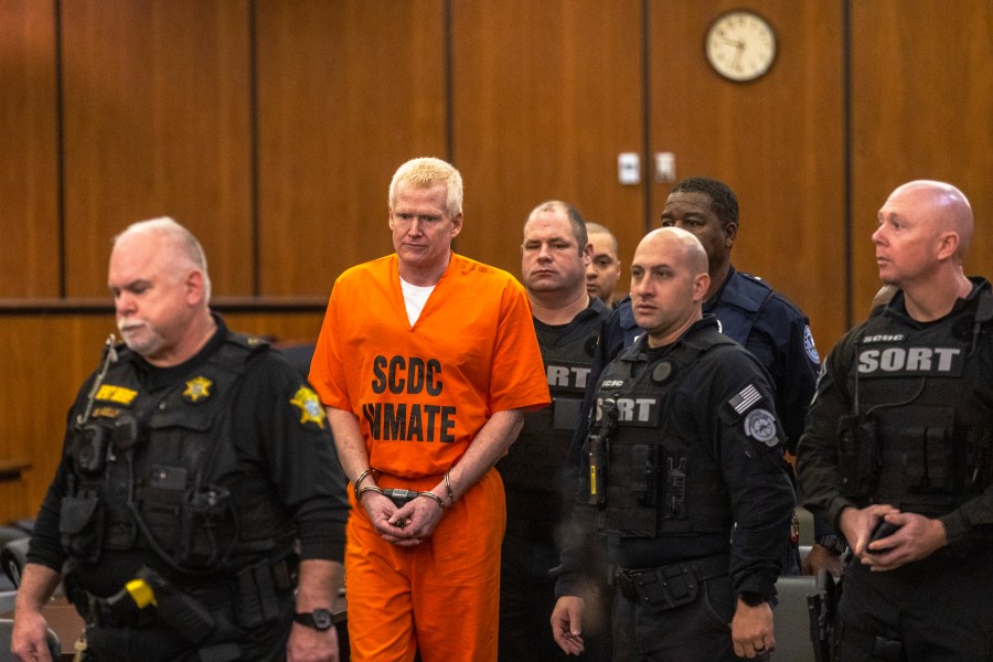 FILE - Alex Murdaugh, second from left, is brought out into the courtroom during a jury-tampering hearing at the Richland County Judicial Center, Monday, Jan. 29, 2024, in Columbia, S.C. (Andrew J. Whitaker/The Post And Courier via AP, Pool, File)