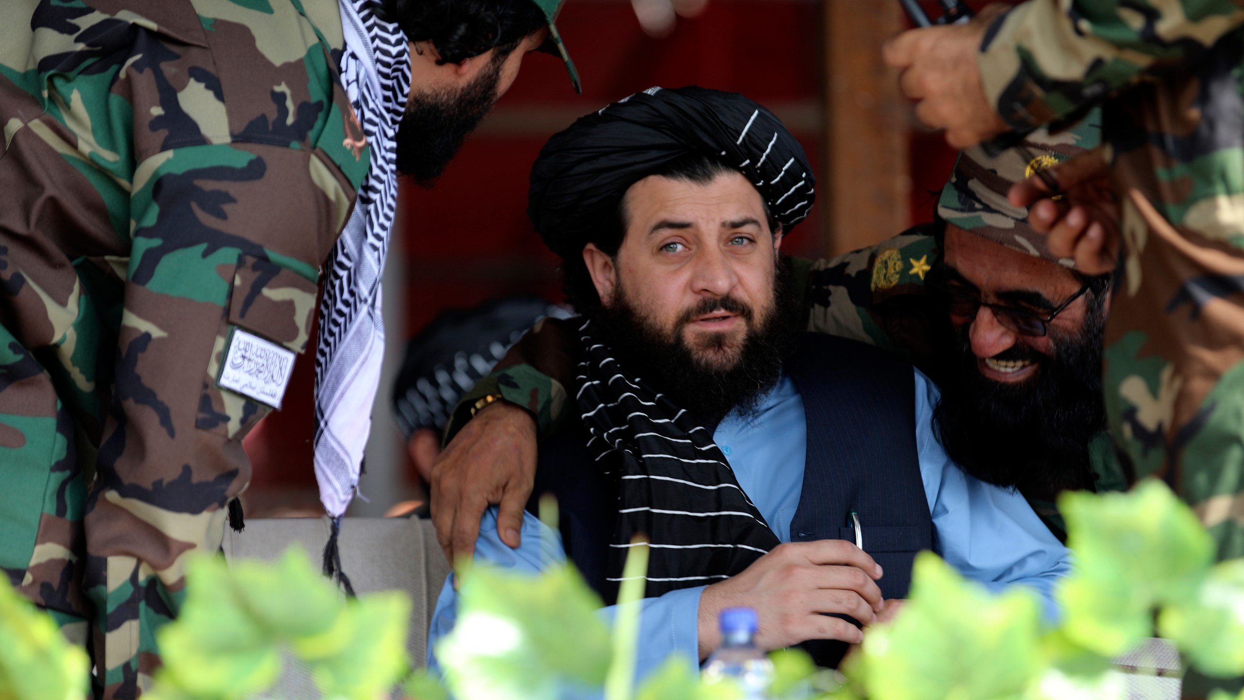 Afghan Taliban's Acting Minister of Defence Mullah Mohammad Yaqoob, center, attend during a military parade to mark the third anniversary of the withdrawal of U.S.-led troops from Afghanistan, in Bagram Air Base in the Parwan Province of Afghanistan, Wednesday, Aug. 14, 2024. (AP Photo/Siddiqullah Alizai)