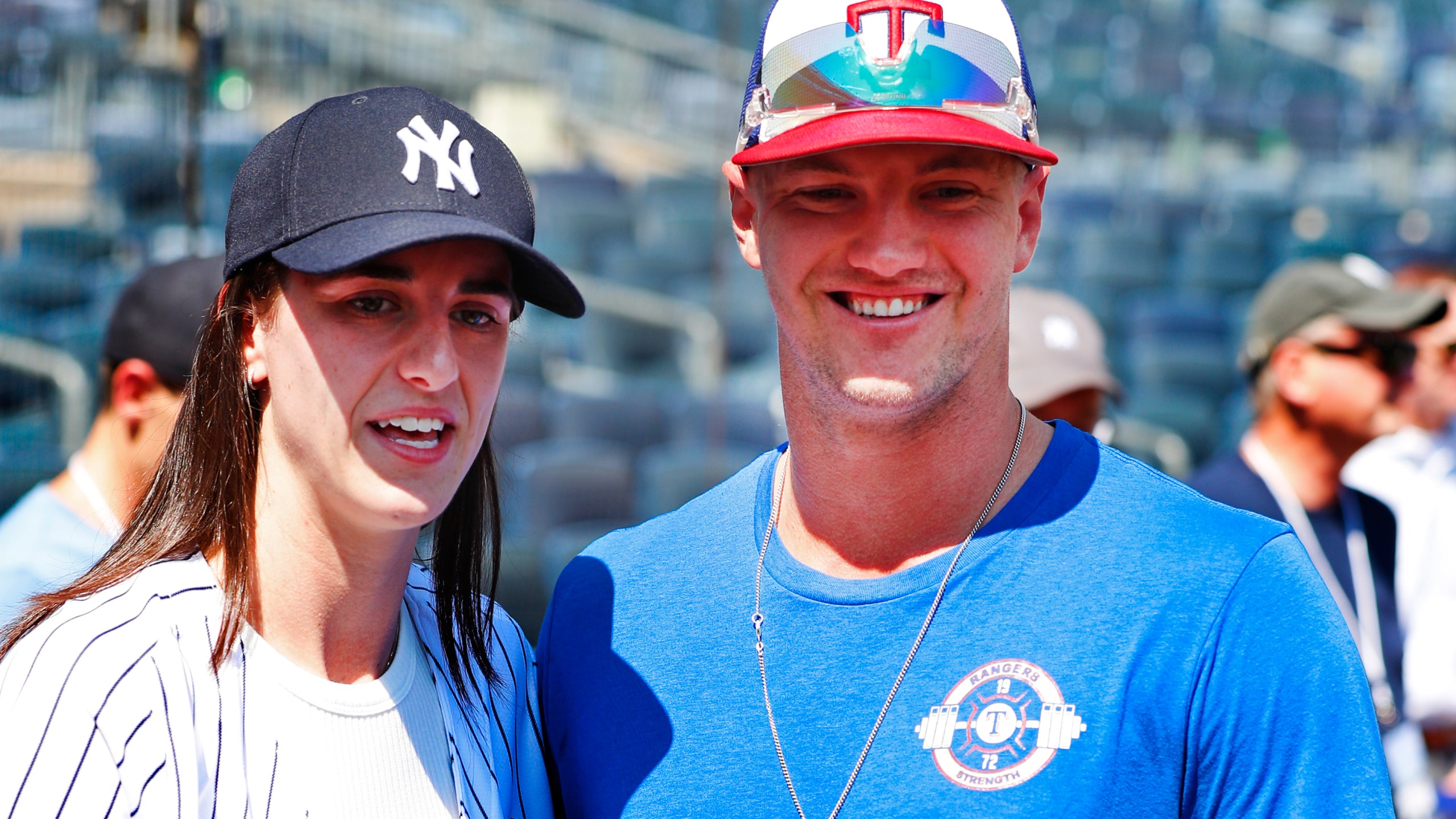 WNBA basketball player Caitlin Clark and Texas Rangers Josh Jung are photographed before a baseball double header game between the New York Yankees and the Texas Rangers, Saturday, Aug. 10, 2024 in New York. (AP Photo/Noah K. Murray)