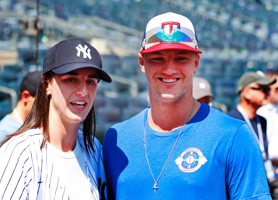 WNBA basketball player Caitlin Clark and Texas Rangers Josh Jung are photographed before a baseball double header game between the New York Yankees and the Texas Rangers, Saturday, Aug. 10, 2024 in New York. (AP Photo/Noah K. Murray)