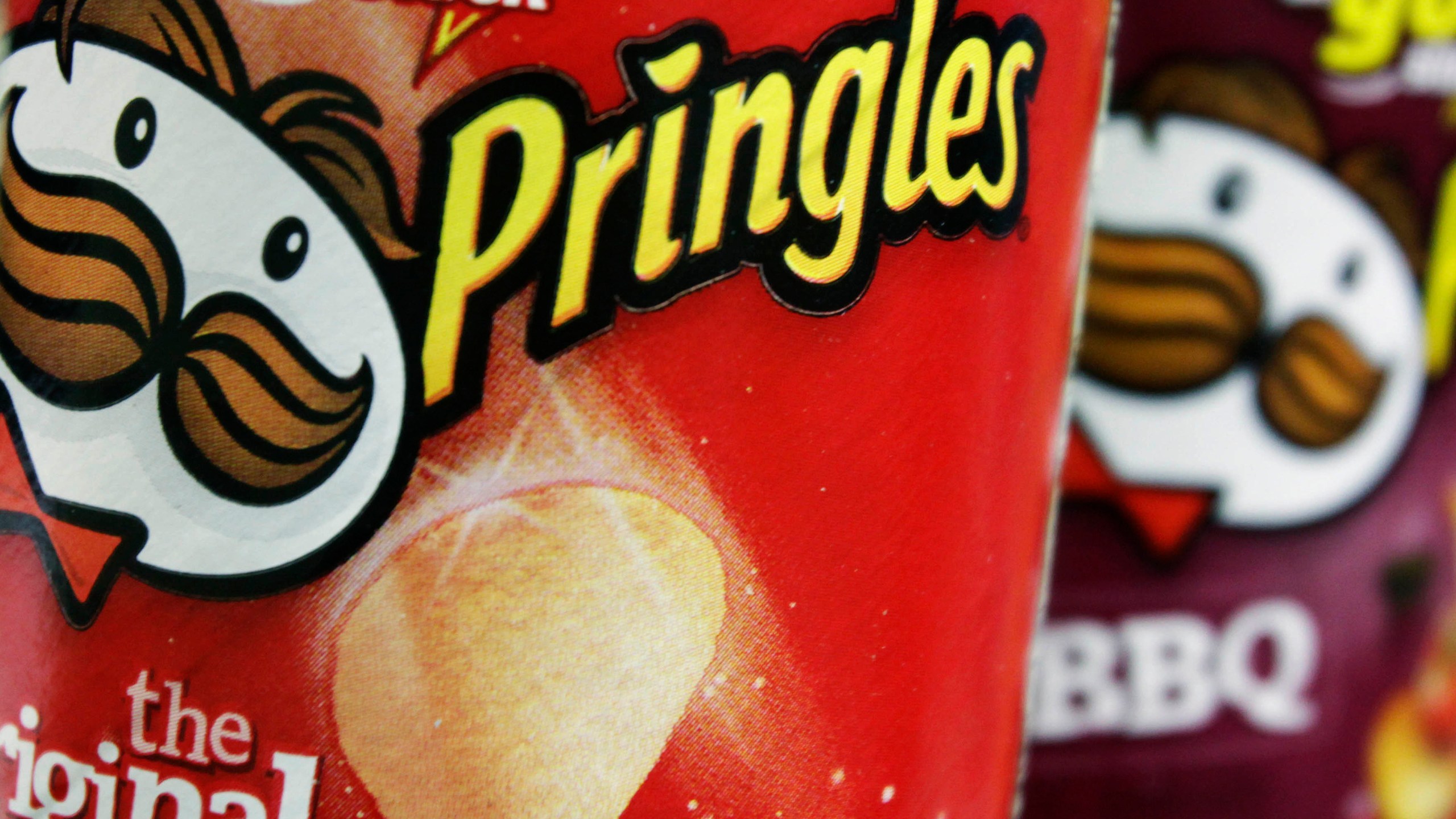 FILE - In this April 5, 2011 file photo, Pringles chips are seen in a posed photo at a West Bath, Maine grocery store. (AP Photo/Pat Wellenbach, File)