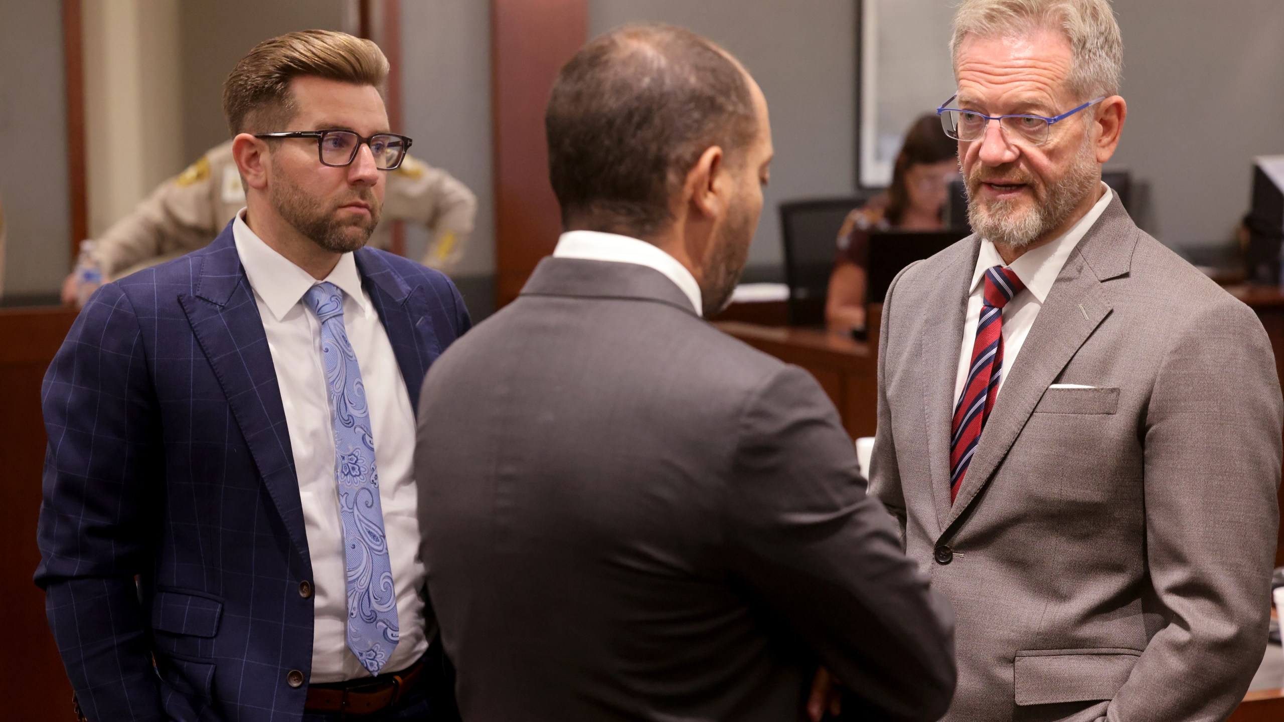 Robert Draskovich, right, and Michael Horvath, left, attorneys for Robert Telles, talk to Chief Deputy District Attorney Christopher Hamner prior to jury selection on the second day of Telles' murder trial at the Regional Justice Center in Las Vegas Tuesday, Aug. 13, 2024. Telles, a former Clark County public administrator, is charged in the murder of Las Vegas Review-Journal investigative journalist Jeff German. (K.M. Cannon/Las Vegas Review-Journal via AP, Pool)