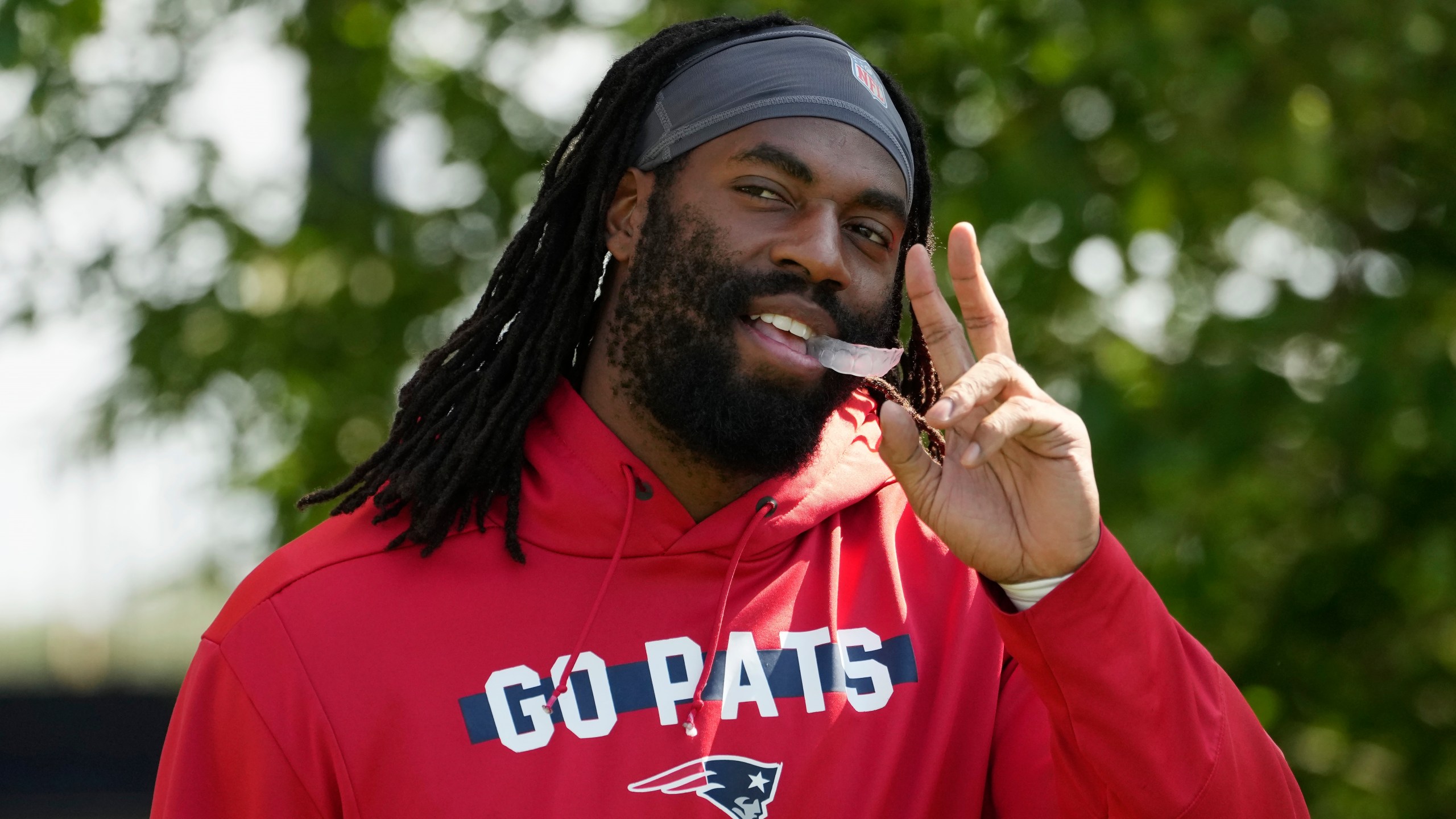 New England Patriots linebacker Matthew Judon walks onto the field during a joint NFL football practice with the Philadelphia Eagles, Tuesday, Aug. 13, 2024, in Foxborough, Mass. (AP Photo/Michael Dwyer)