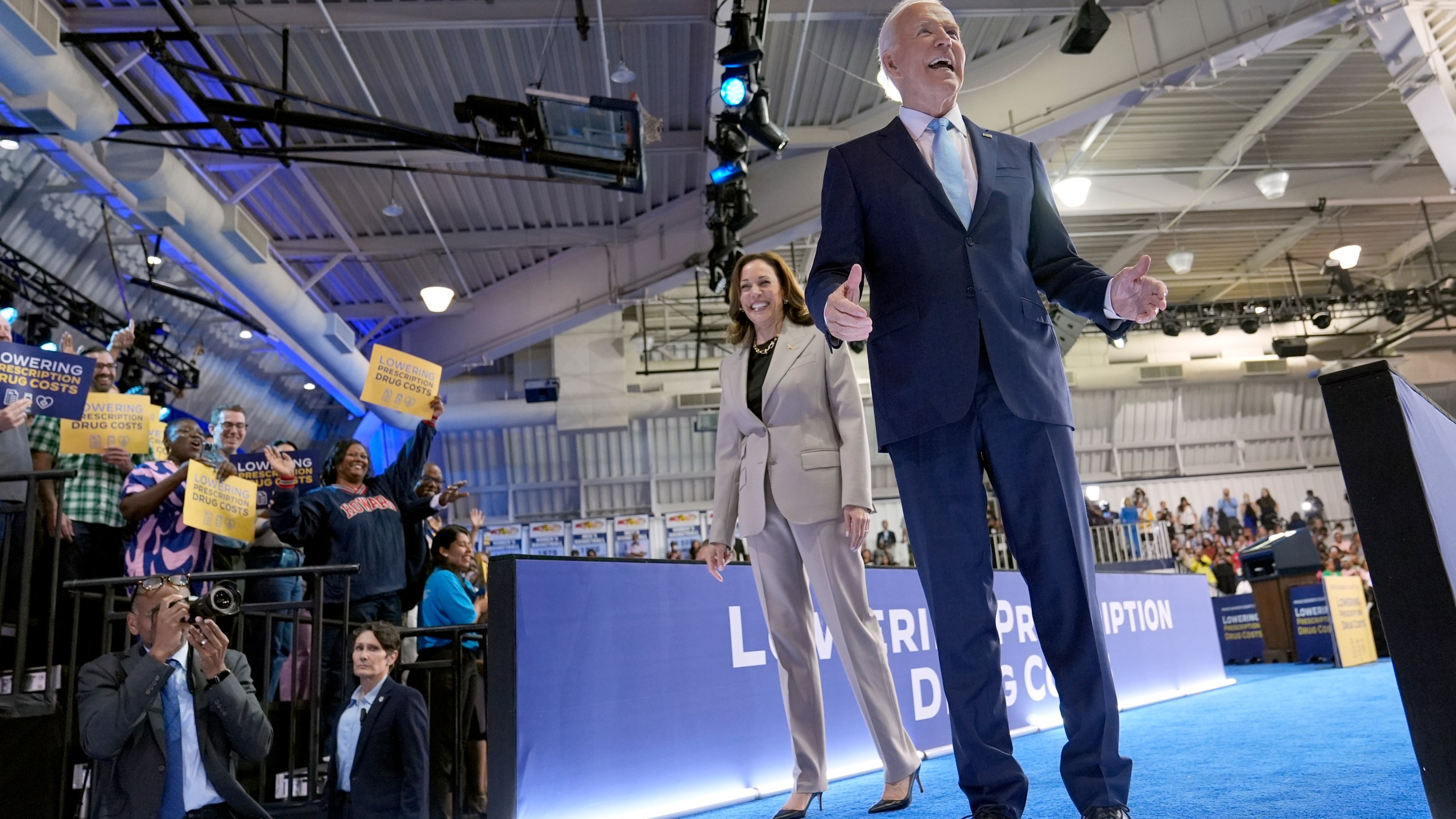 Democratic presidential nominee Vice President Kamala Harris, left, and President Joe Biden depart after speaking about the administration's efforts to lower prescription drug costs during an event at Prince George's Community College in Largo, Md., Thursday, Aug. 15, 2024. (AP Photo/Susan Walsh)