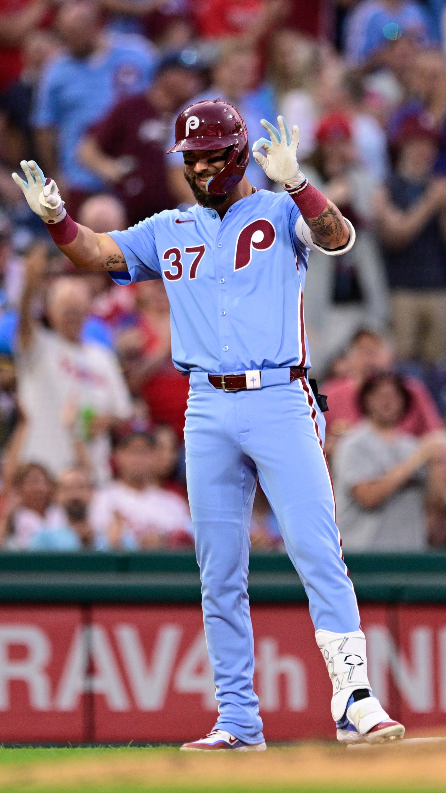 Philadelphia Phillies' Weston Wilson reacts after hitting a triple off Washington Nationals' Mitchell Parker during the fourth inning of a baseball game, Thursday, Aug. 15, 2024, in Philadelphia. (AP Photo/Derik Hamilton)