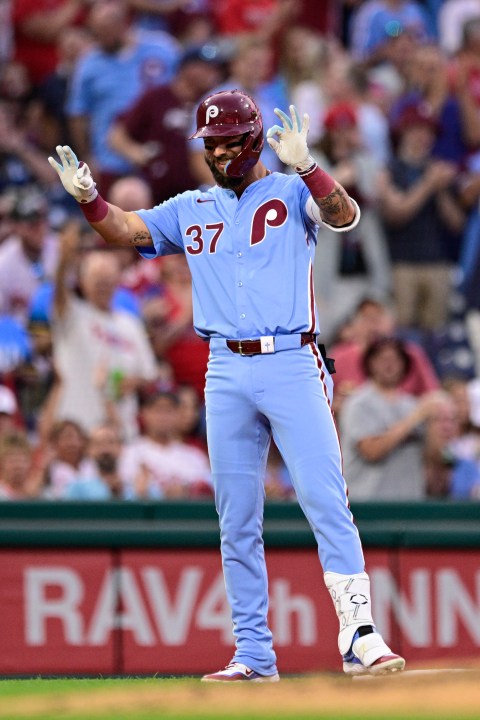 Philadelphia Phillies' Weston Wilson reacts after hitting a triple off Washington Nationals' Mitchell Parker during the fourth inning of a baseball game, Thursday, Aug. 15, 2024, in Philadelphia. (AP Photo/Derik Hamilton)