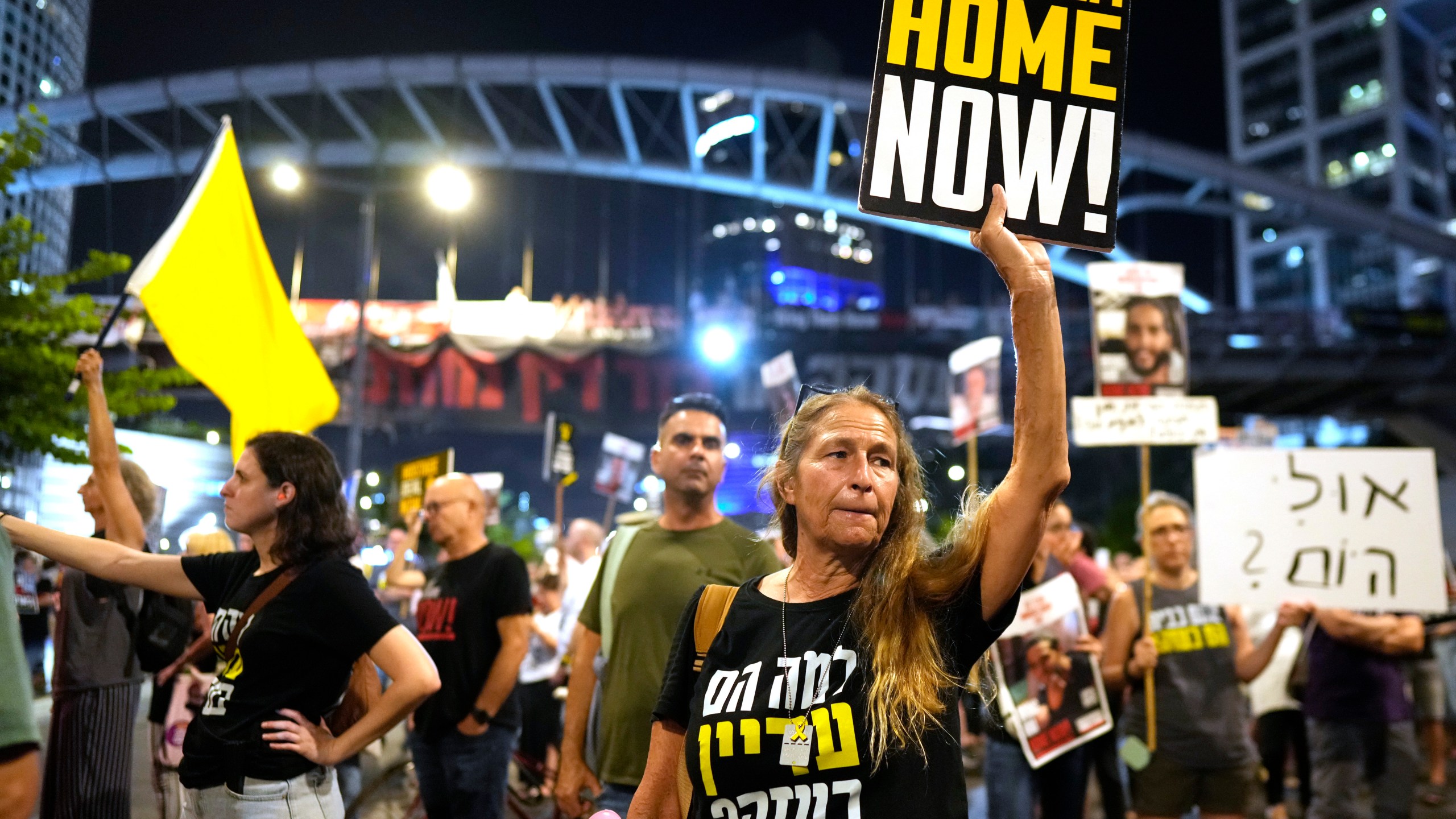 Relatives of hostages held by Hamas in the Gaza Strip and their supporters protest in Tel Aviv, Israel, Thursday, Aug. 15, 2024, as International mediators held a new round of talks aimed at halting the Israel-Hamas war and securing the release of scores of hostages. (AP Photo/Ohad Zwigenberg)