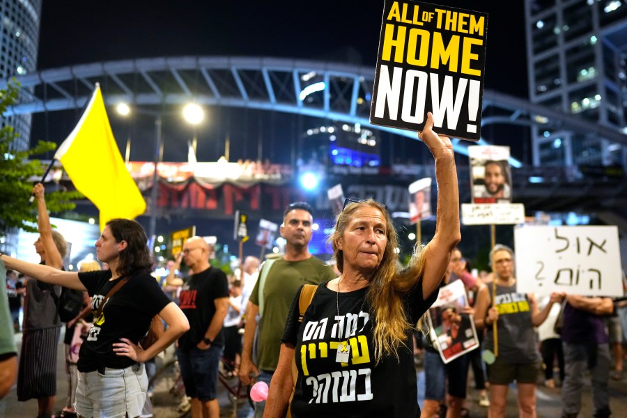 Relatives of hostages held by Hamas in the Gaza Strip and their supporters protest in Tel Aviv, Israel, Thursday, Aug. 15, 2024, as International mediators held a new round of talks aimed at halting the Israel-Hamas war and securing the release of scores of hostages. (AP Photo/Ohad Zwigenberg)