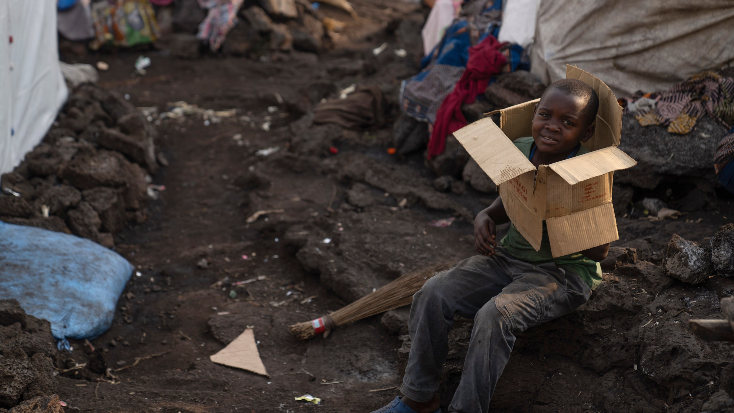 A child plays in the Bulengo refugee camp in Goma, Congo, after the World Health Organization had declared Thursday, Aug, 15, 2024, the increasing spread of mpox in Africa a global health emergency, warning the virus might ultimately spill across international borders. (AP Photo/Moses Sawasawa)