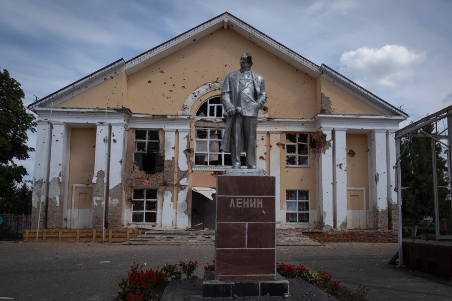 A damaged monument to Soviet founder Vladimir Lenin stands in a central square in Sudzha, Kursk region, Russia, Friday, Aug. 16, 2024. This image was approved by the Ukrainian Defense Ministry before publication. (AP Photo)