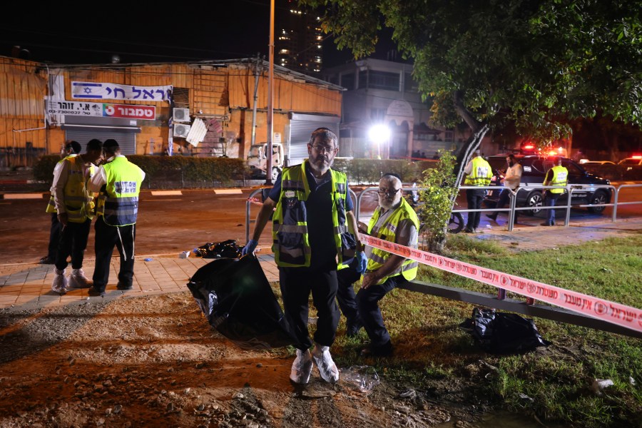 An Israeli ZAKA volunteer works at the scene of a bomb explosion in Tel Aviv, Israel, Sunday, Aug. 18, 2024. Israeli Police say one person was killed and another moderately injured. (AP Photo/Moti Milrod)