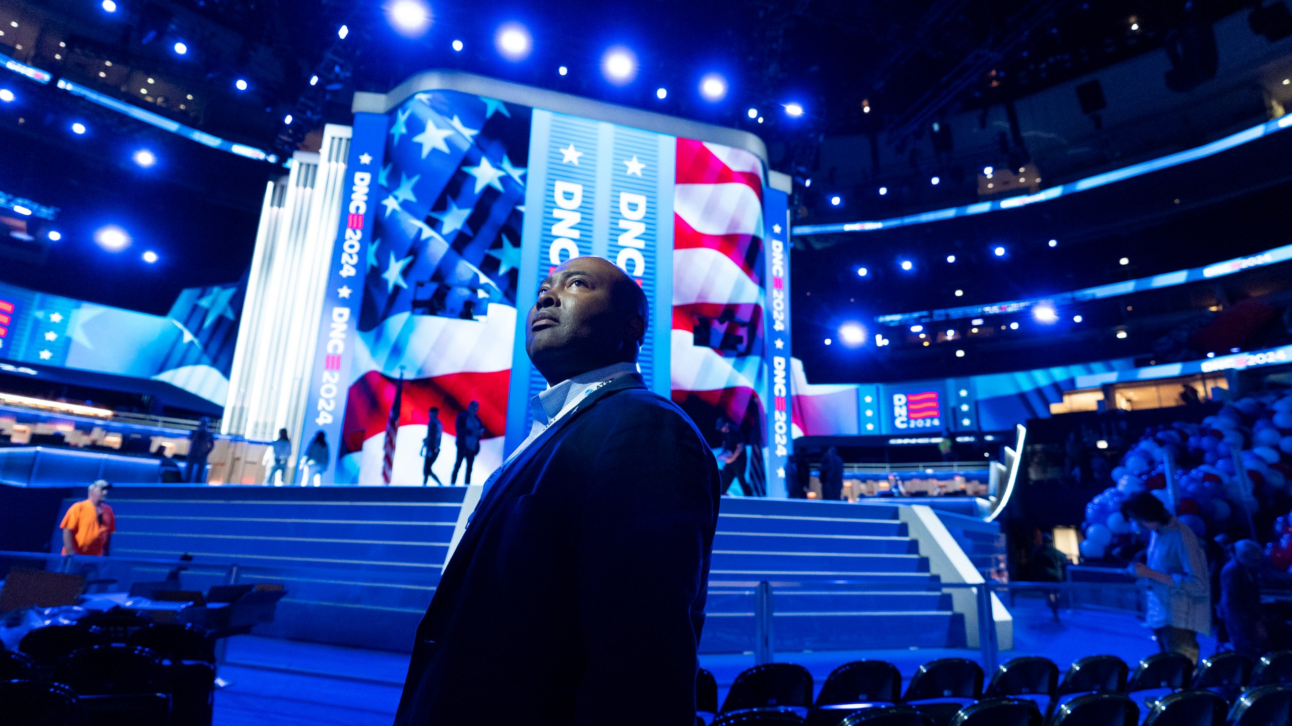 Jaime Harrison, Democratic National Committee chair, watches as preparations are made before the upcoming Democratic National Convention, Thursday, Aug. 15, 2024, in Chicago. (AP Photo/Alex Brandon)