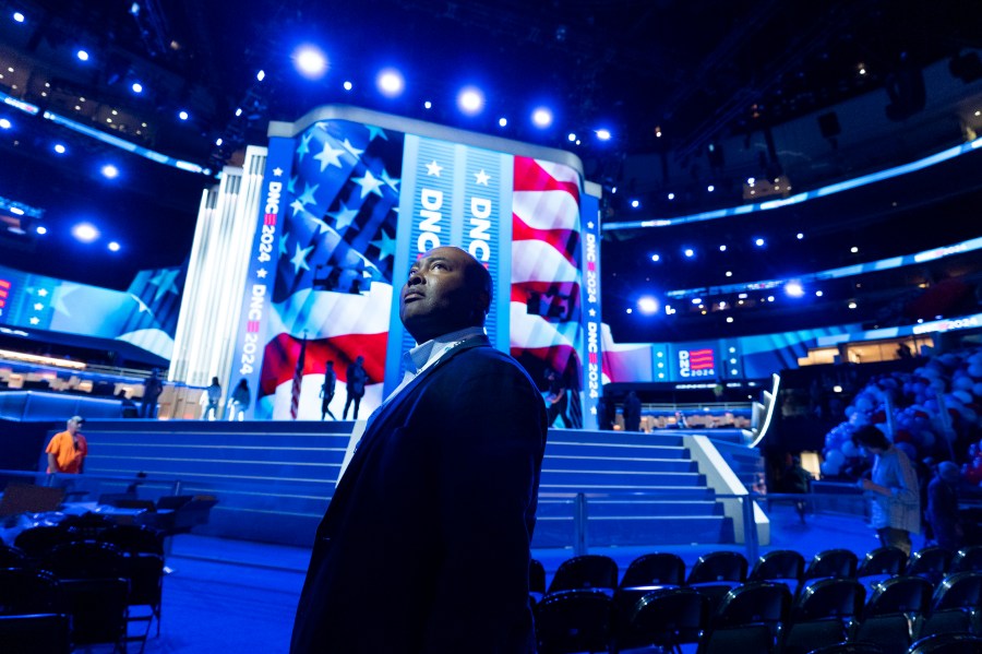 Jaime Harrison, Democratic National Committee chair, watches as preparations are made before the upcoming Democratic National Convention, Thursday, Aug. 15, 2024, in Chicago. (AP Photo/Alex Brandon)