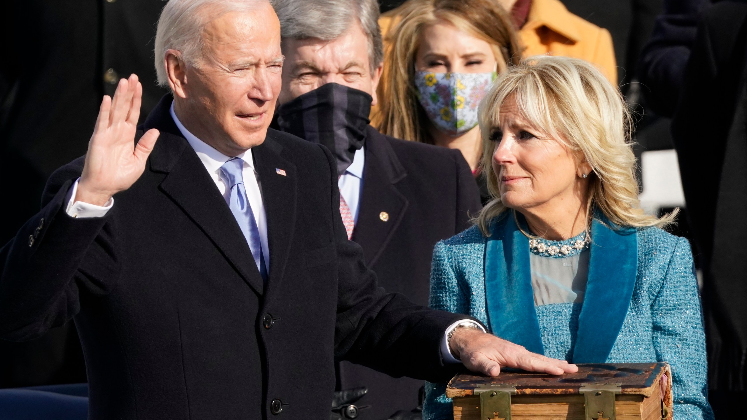 FILE - Joe Biden is sworn in as the 46th president of the United States by Chief Justice John Roberts as Jill Biden holds the Bible during the 59th Presidential Inauguration at the U.S. Capitol in Washington, Jan. 20, 2021. (AP Photo/Andrew Harnik, File)