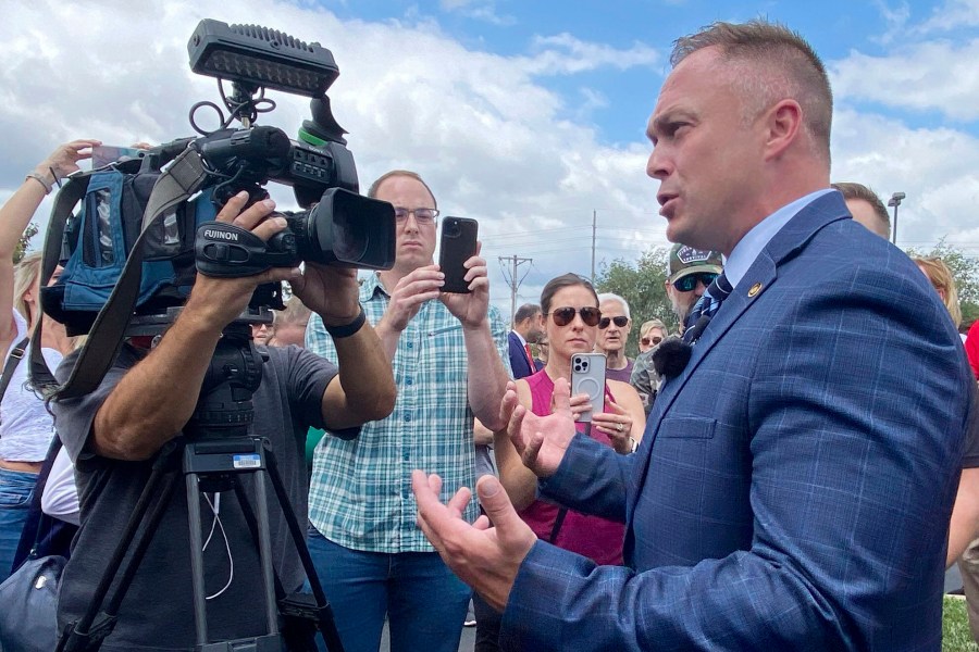 State Rep. Justin Sparks, R-Wildwood, fields questions from reporters during a press conference to address a transgender woman using the women's locker room at the Life Time fitness center in Ellisville, Mo., Friday, Aug. 2. (Ethan Colbert/St. Louis Post-Dispatch via AP)