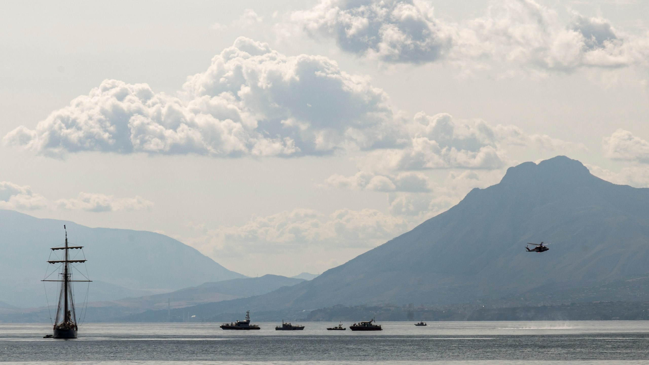 Rescuers work in the area where the UK flag vessel Bayesan that was hit by a violent sudden storm, sunk early Monday, Aug. 19, 2024, while at anchor off the Sicilian village of Porticello near Palermo, in southern Italy. (AP Photo/Lucio Ganci)