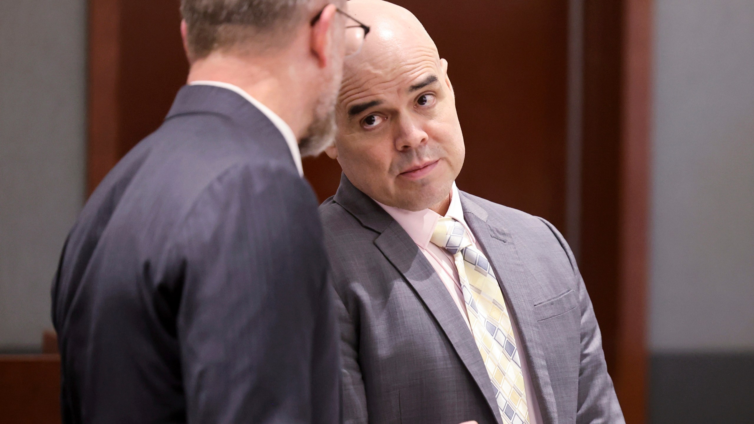 Robert Telles, a former Clark County public administrator charged in the murder of Las Vegas Review-Journal investigative journalist Jeff German, right, talks with attorney Robert Draskovich during a break in testimony during his murder trial at the Regional Justice Center in Las Vegas, Friday, Aug. 16, 2024. (K.M. Cannon/Las Vegas Review-Journal via AP, Pool)