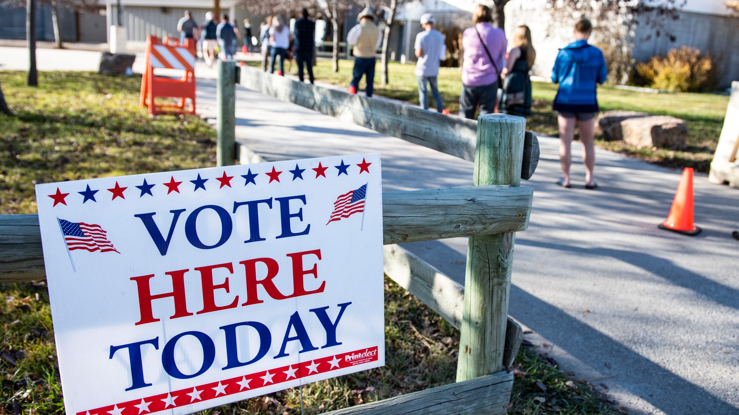 Patrons of the Gallatin County Fairgrounds wait in line to cast their ballots in Bozeman, Montana.