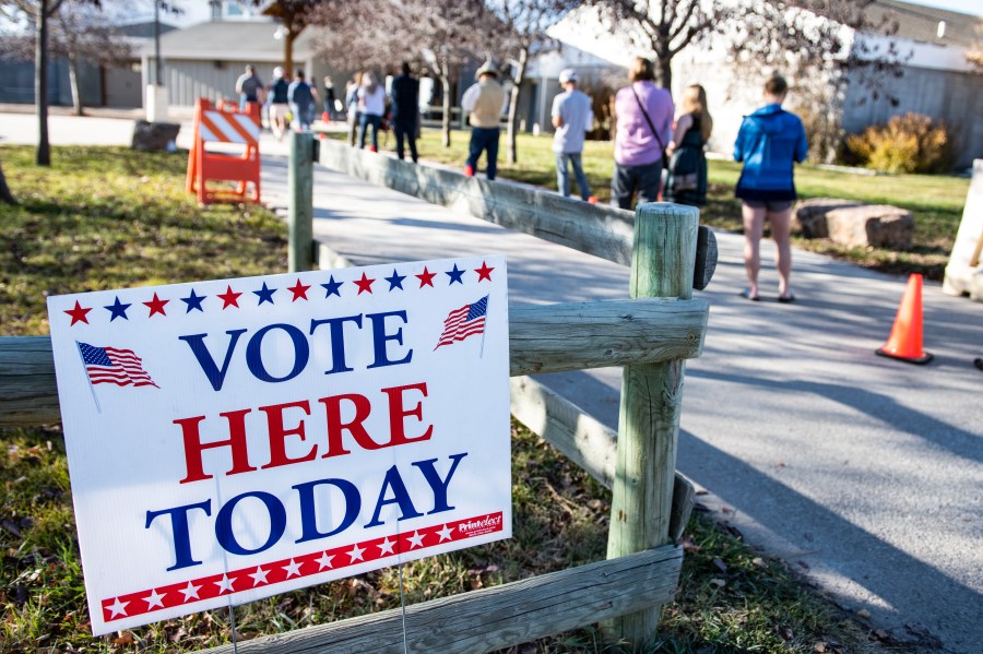 Patrons of the Gallatin County Fairgrounds wait in line to cast their ballots in Bozeman, Montana.