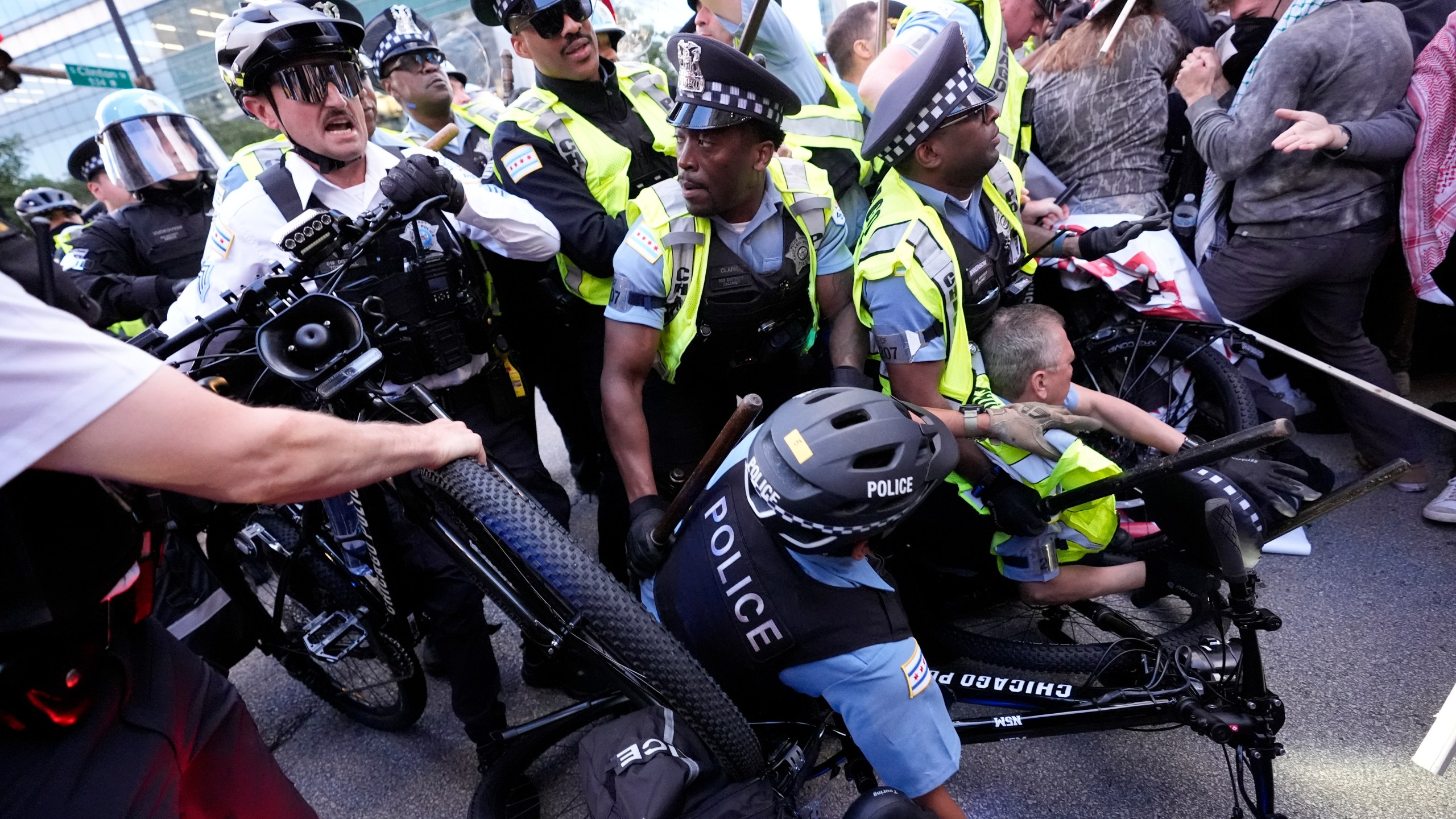 Demonstrators clash with police near the Israeli Consulate during the Democratic National Convention Tuesday, Aug. 20, 2024, in Chicago. (AP Photo/Alex Brandon)