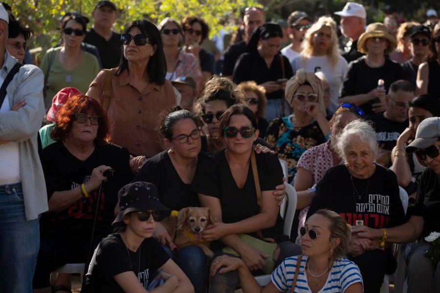 Rimon Buchshtab, center, mourns during the funeral of her husband Yagev Buchshtab at a cemetery of the kibbutz Nirim, southern Israel, Wednesday, Aug. 21, 2024. Buchshtab's body was one the six bodies of hostages, taken in Hamas' Oct. 7 attack, recovered by Israel's military during an operation in the Gaza Strip. (AP Photo/Leo Correa)