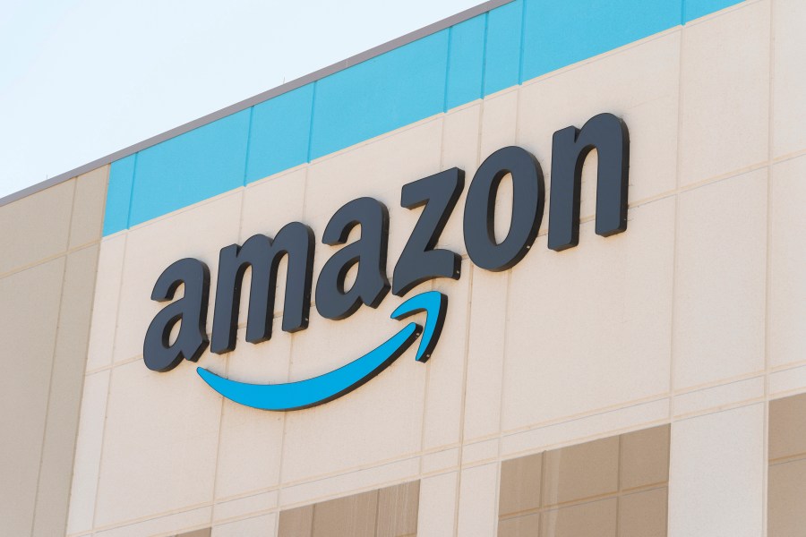 The Amazon logo is seen on the exterior wall of the Amazon OXR1 fulfillment center in Oxnard, Calif., on Wednesday, Aug. 21, 2024. (AP Photo/Damian Dovarganes)