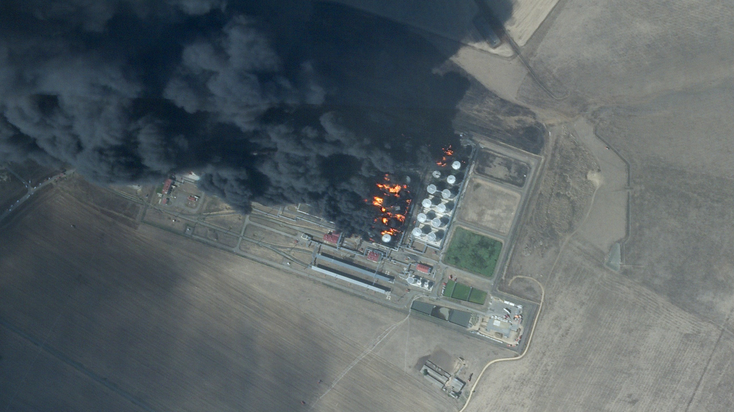 This satellite photo from Planet Labs PBC shows a fire at an oil depot earlier hit by a Ukrainian drone attack near Proletarsk, Russia, Monday, Aug. 19, 2024. (Planet Labs PBC via AP)