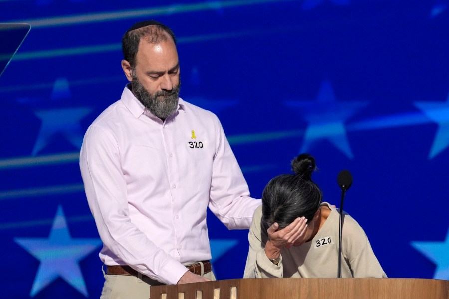 Jon Polin, left, and Rachel Goldberg, parents of Hersh Goldberg-Polin, speak on stage during the Democratic National Convention Wednesday, Aug. 21, 2024, in Chicago. (AP Photo/J. Scott Applewhite)