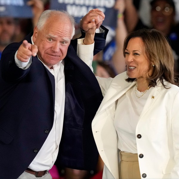 Democratic presidential nominee Vice President Kamala Harris and running mate Minnesota Gov. Tim Walz arrive at a campaign rally Wednesday, Aug. 7, 2024, in Romulus, Mich. (AP Photo/Carlos Osorio)