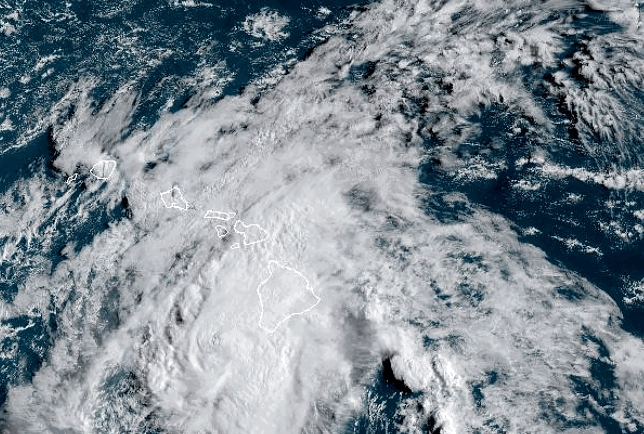 This Aug. 25, 2024 satellite image provided by the National Oceanic and Atmospheric Administration shows Hurricane Hone passing south of Hawaii. (NOAA via AP)