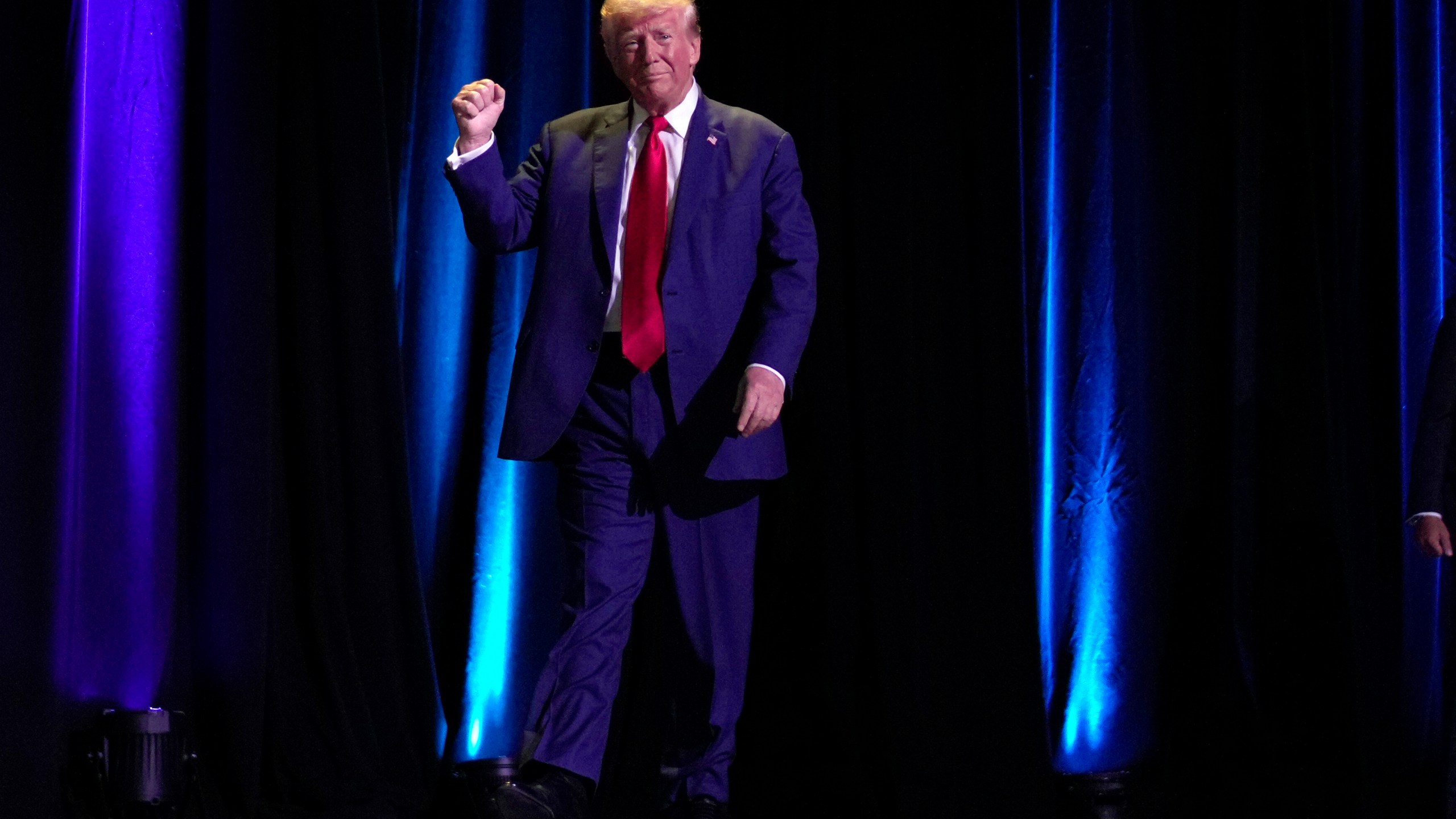 Republican presidential nominee former President Donald Trump walks on stage to speak at the National Guard Association of the United States' 146th General Conference, Monday, Aug. 26, 2024, in Detroit. (AP Photo/Carolyn Kaster)