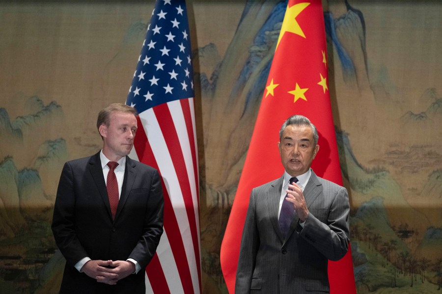 Wang Yi, right, the director of the Communist Party's Central Foreign Affairs Commission Office speaks as White House national security adviser Jake Sullivan, left, listens to Wang, before their talk at Yanqi lake in Beijing, Tuesday, Aug. 27, 2024. (AP Photo/Ng Han Guan, Pool)