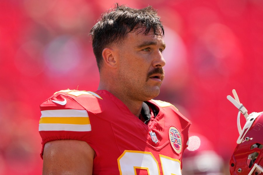 Kansas City Chiefs tight end Travis Kelce (87) warms up before an NFL preseason football game against the Detroit Lions Saturday, Aug. 17, 2024, in Kansas City, Mo. (AP Photo/Charlie Riedel)