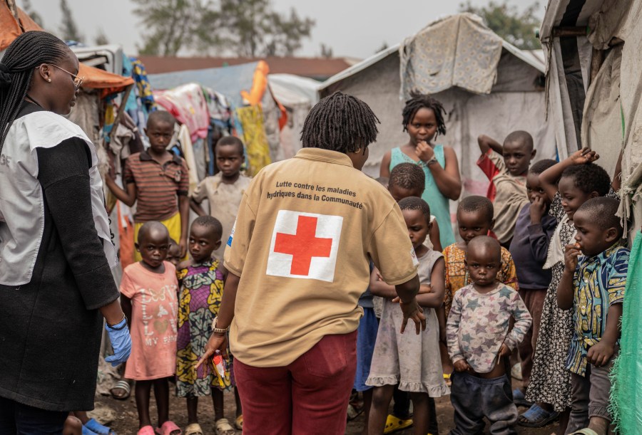 Red Cross officials create awareness around mpox in the Don Bosco refugee camp in Goma, Democratic Republic of Congo, Thursday, Aug. 22, 2023. (AP Photo/Moses Sawasawa)