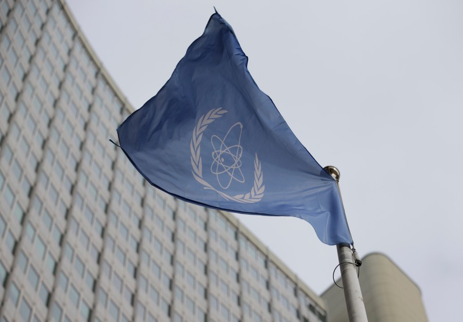 FILE - The flag of the International Atomic Energy Agency flies in front of its headquarters during an IAEA Board of Governors meeting in Vienna, Austria, on Feb. 6, 2023. (AP Photo/Heinz-Peter Bader, File)