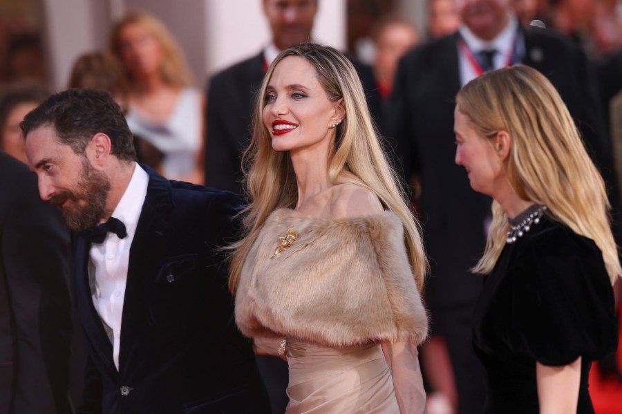 Director Pablo Larrain, from left, Angelina Jolie, and Alba Rohrwacher pose for photographers upon arrival for the premiere of the film 'Maria' during the 81st edition of the Venice Film Festival in Venice, Italy, on Thursday, Aug. 29, 2024. (Photo by Vianney Le Caer/Invision/AP)