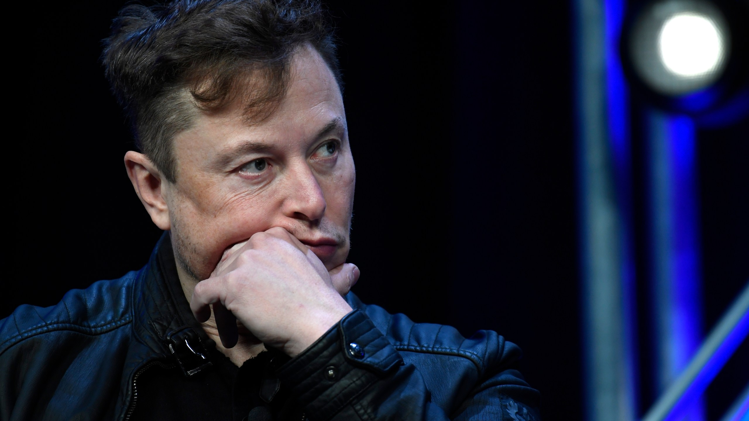 Elon Musk listens to a question as he speaks at the SATELLITE Conference and Exhibition in Washington, March 9, 2020.