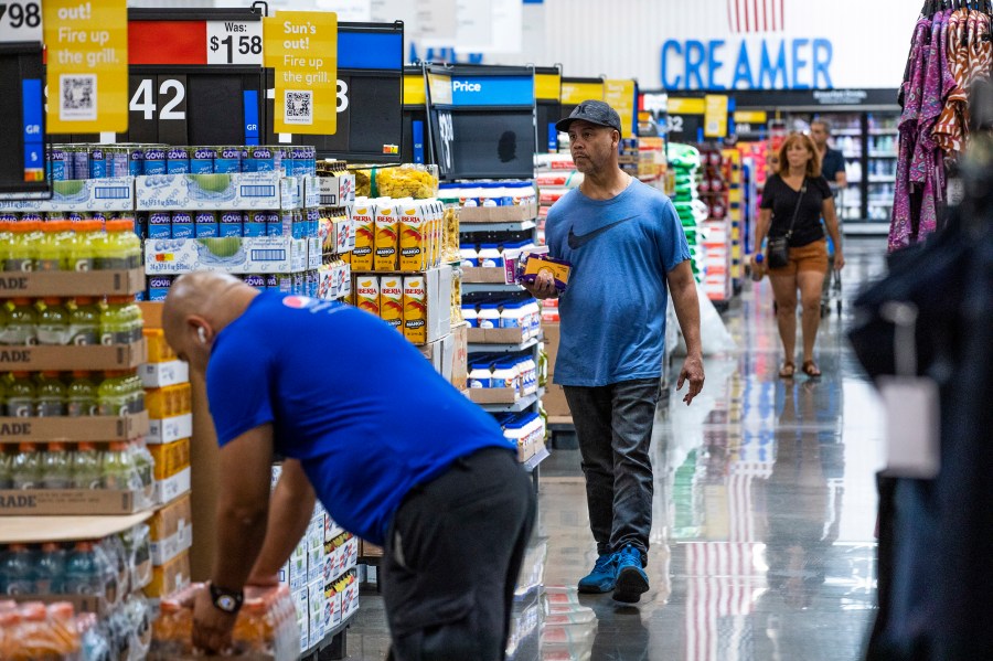 FILE - People shop at a Walmart Superstore in Secaucus, New Jersey, July 11, 2024. (AP Photo/Eduardo Munoz Alvarez, File)